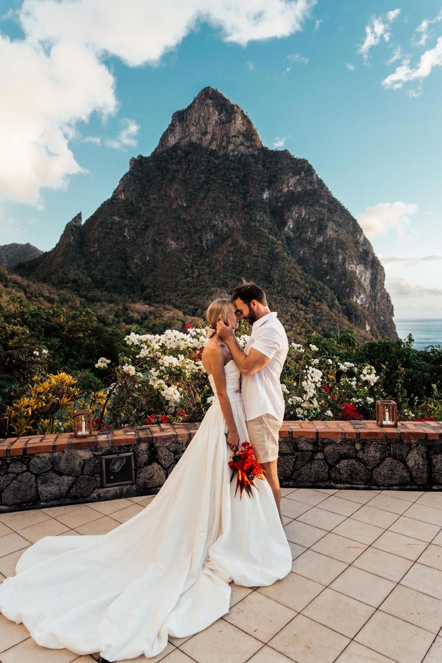 Bride and groom embracing with mountain background